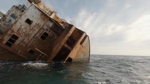 Wreck ship on reefs in sea or ocean.