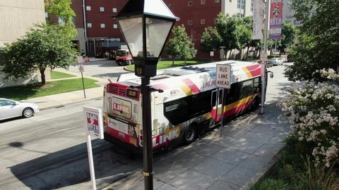 Baltimore , MD / United States - 08 23 2020: Establishing shot in downtown Baltimore, near Babe Ruth birthplace and museum, University of Maryland Hospital entrance, city transit parked in bus lane