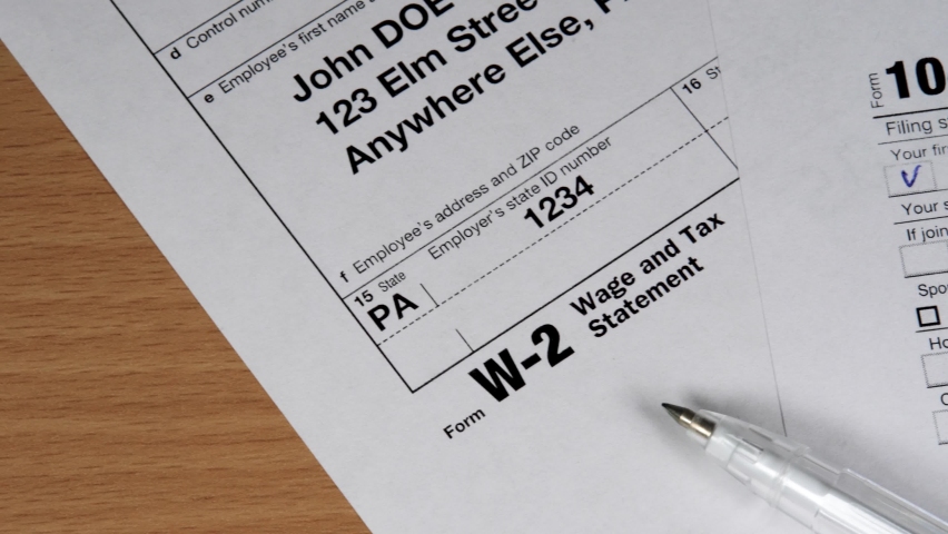 W-2 and 1040 Tax Form. Tax Payment Concept. Filing Taxes Document on Table in Office. Individual Income Tax Return | Shutterstock HD Video #1060301840