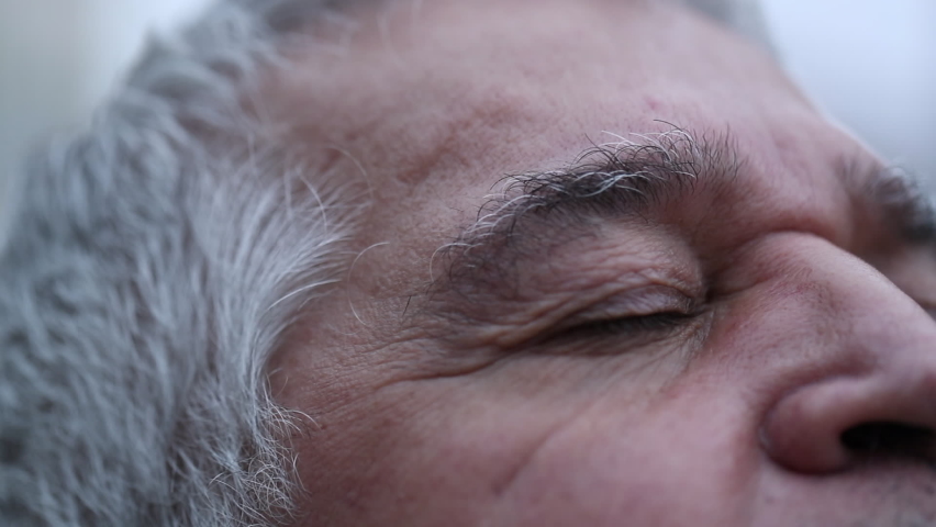 Senior man opening eyes looking at sky with hope and faith. Royalty-Free Stock Footage #1060310684