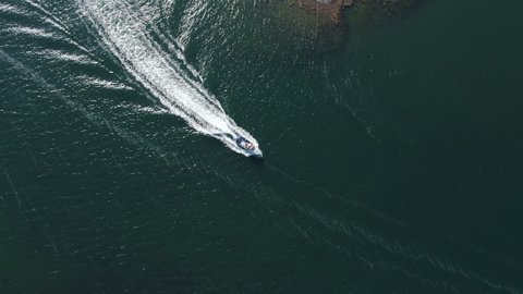 Aerial view of boat coming into a harbour at Inishgort, Clew Bay, on the west coast of Ireland.