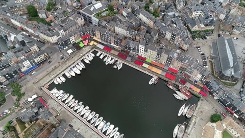 Aerial view of Honfleur is a commune in the Calvados department in northwestern France which is especially known for its old port characterized by its houses with slate-covered frontages 4k quality