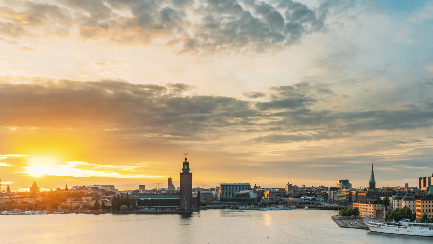 Stockholm, Sweden. Skyline Cityscape Famous View Of Old Town Gamla Stan In Summer Evening. Famous Popular Destination Scenic UNESCO World Heritage Site. Popular City Hall, Riddarholm Church In Sunset Royalty-Free Stock Footage #1060325306