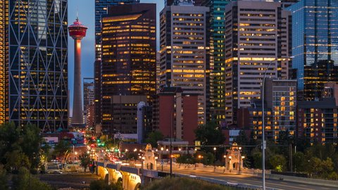 Calgary, Alberta, Canada, day to night time lapse sequence showing traffic and modern landmark buildings in the financial district. 