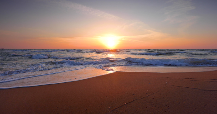 Ocean beach sunrise and dramatic colorful sky clouds | Shutterstock HD Video #1060331168