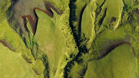 Aerial flying over the lava flows and green moss of  Eyjafjallajokull volcano in Iceland