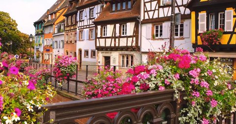 View on the street in Colmar, colourful buildings in romantic old town, summer. Alsace, France