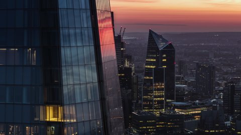 Cinematic Aerial View Shot of London UK, City of London in stunning red orange light, United Kingdom