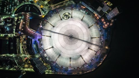 London, United Kingdom - circa 2020: Aerial View Shot of London UK, Top Down of The O2 Arena, Millennium Dome, Greenwich Peninsula, United Kingdom, at night evening