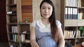 Asian pregnant woman live web camera online to talk about life style to eat for new mother healthy. 