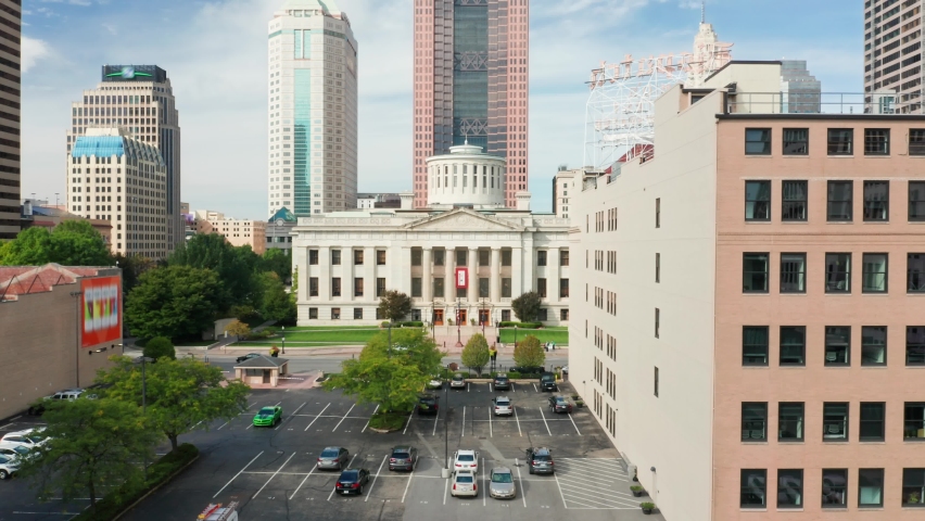 Aerial view of the Ohio State House, in Columbus with frontal camera approach . The Ohio Statehouse is the state capitol building and seat of government for the U.S. state of Ohio Royalty-Free Stock Footage #1060349993