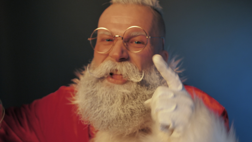 Negative Emotions of Angry Crazy Mad Screaming Santa Claus Swearing at Naughty Kid which will Not Receiving Holiday Gift for Behaved Badly all Year Closeup Indoors. Aggressive Furious Talk, Discontent