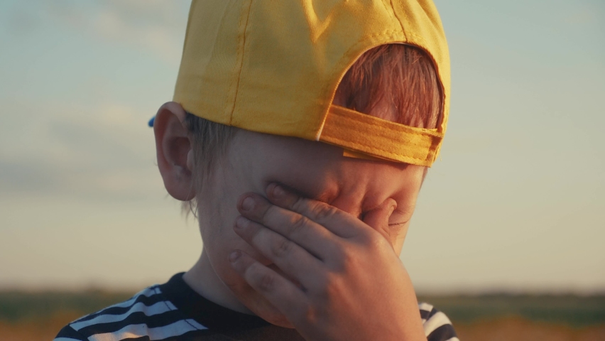 boy kid crying flowing tears a screaming dirty face. child son scream disappointed lifestyle cranky. domestic violence concept. close-up toddler roared all in tears Royalty-Free Stock Footage #1060351922