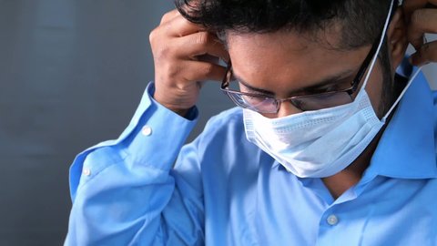 young businessman wearing protective mask 