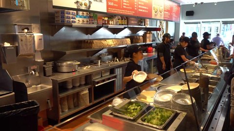 Toronto, Canada-12 November, 2019:  Mexican fast food franchise Chipotle restaurant serving national Mexican food in a busy downtown location