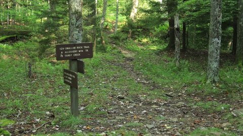 A signpost for the intersection of the Seneca Creek Trail and the Swallow Rock Trail, within the Spruce Knob-Seneca Rocks National Recreation Area in West Virginia.  