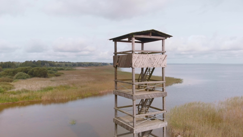 Aerial drone view of northern Europe landscape, Vortsjarv lake with observational tower, circle pan, day