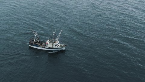 Fishermen On A Fishing Trawler Boat Sailing At The Open Waters Of Saint Lawrence River In Quebec, Canada. - aerial drone shot