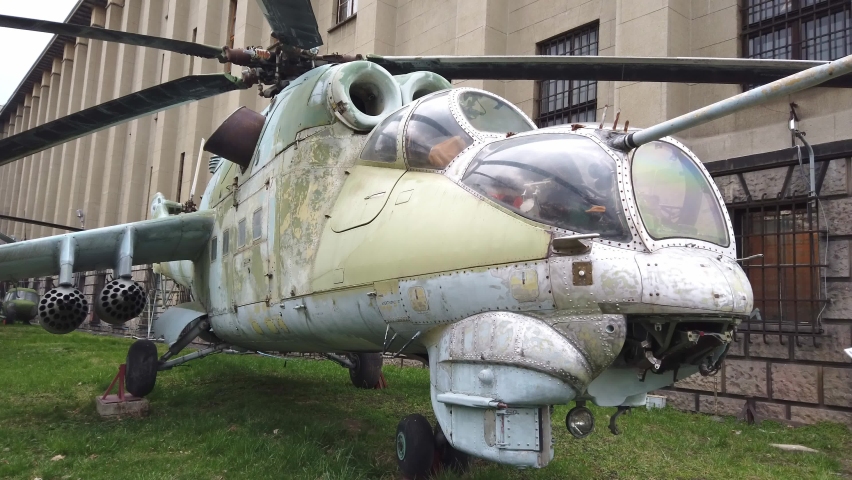 A Medium shot of old military helicopter displayed on a museum.