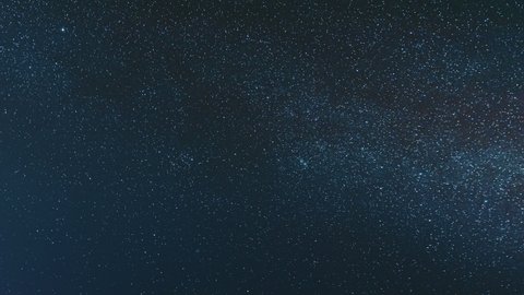 Night Starry Sky With Glowing Stars. Bright Glow Of Planet Venus In Sky Among The Milky Way Galaxy Stars. Sky In Lights Of Sunset Dawn. 4K Timelapse.