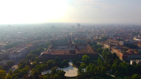 Aerial panoramic view of Milan cityscape, historic medieval Sforza fortress and Sempione Arco della Pace park, Italy landscape panorama from above, Europe. Cinematic look. Milan, Italy, 01.10.2020: