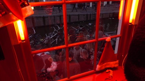AMSTERDAM, NETHERLANDS - SEPTEMBER 23, 2020: Red Light District Dollhouse Window from Inside