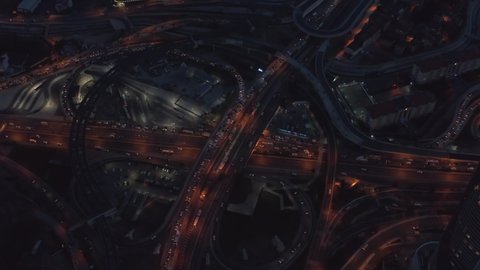 Big Interstate Freeway Connection with Traffic Jam at Night, Aerial Birds Eye Overhead Drone Perspective