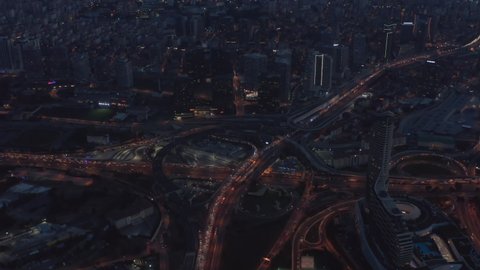 Traffic Jam on Huge Freeway Intersection in Istanbul at Dusk, Aerial forward tilt down