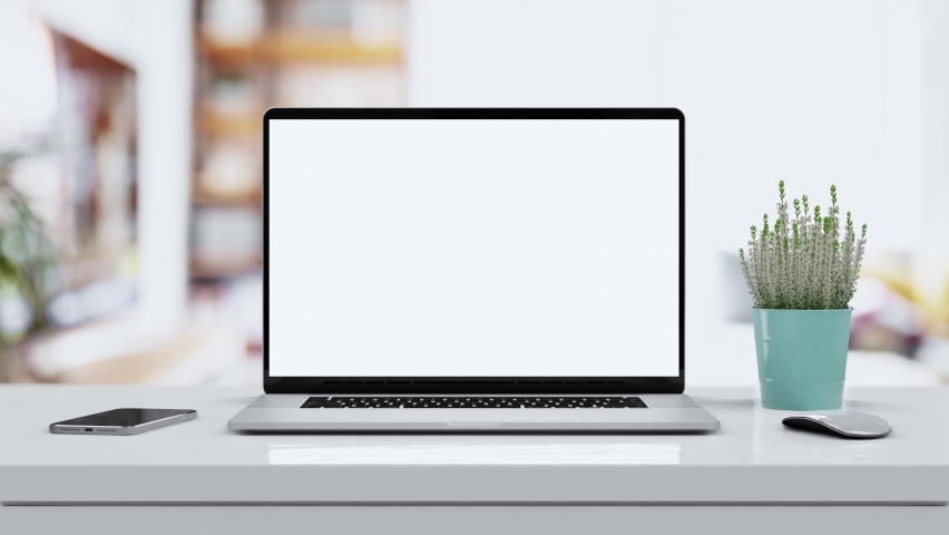 Laptop with blank screen smooth zoom in - white table with mouse and smartphone. Home interior or office background, 4k 30fps UHD Royalty-Free Stock Footage #1060390283