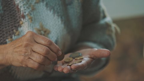 Homeless old woman counting last coins. Close up. High quality 4k footage