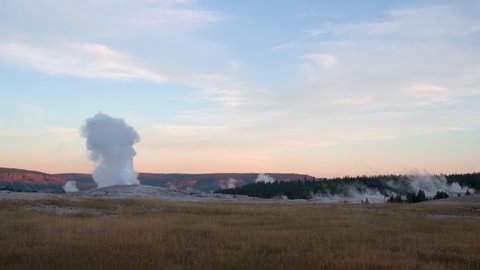 Morning sunrise Time-lapse at Old faithful geyser Yellowstone National Park 