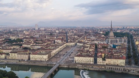 Establishing Aerial View Shot of Turin IT, Mole Antonelliana on the horizon, Torino Skyline, Italy