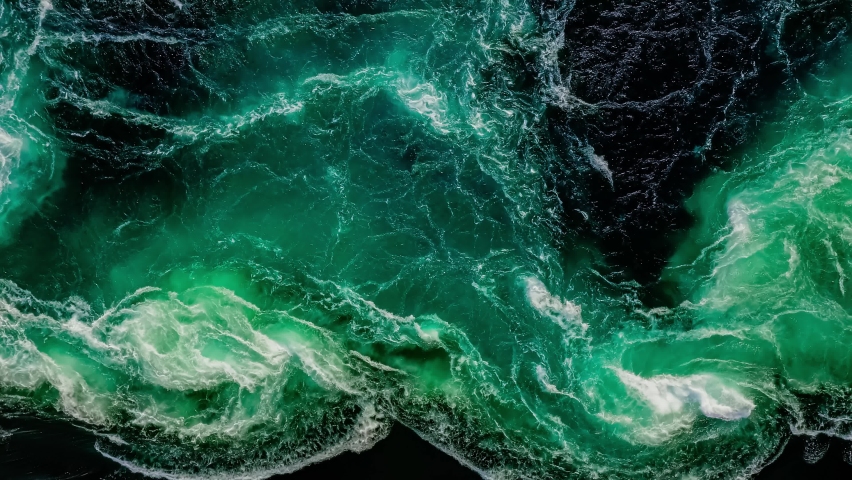 Waves of water of the river and the sea meet each other during high tide and low tide. Whirlpools of the maelstrom of Saltstraumen, Nordland, Norway | Shutterstock HD Video #1060402415