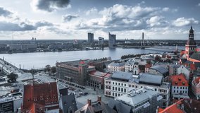 Timelapse aerial view of the Riga old town from above with Domes cathedral in the middle of the city and river Daugava in the background. Beautiful Latvia and the capital city Riga. Tourism video.