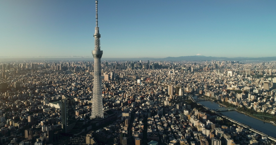 Flying over Tokyo skytree, Tokyo cityscape and Mt. Fuji in Japan Royalty-Free Stock Footage #1060407094