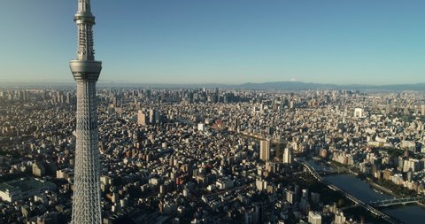 Flying over Tokyo skytree, Tokyo cityscape and Mt. Fuji in Japan