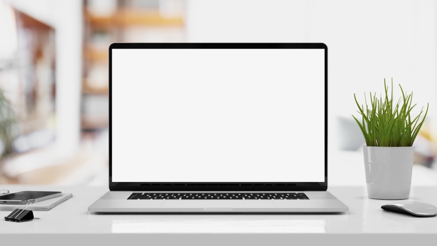 Laptop with blank screen smooth zoom in - white table with mouse and smartphone. Home interior or office background, 4k 30fps UHD Royalty-Free Stock Footage #1060418818