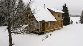 A quiet and warm winter log cabin during a soft snowfall with firewood sitting on the front porch. - Powered by Shutterstock - Get 15% off with code: PIKWIZARD15