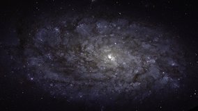 Flying through the stars against the backdrop of a beautiful galaxy with pulsing bright light. 4k 60 fps seamless video loop. Element of this video furnished by NASA