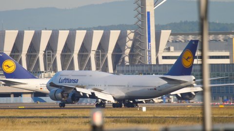 FRANKFURT AM MAIN, GERMANY - JULY 20, 2017: Lufthansa Boeing 747 D-ABYQ braking after landing on runway 25C at Fraport, Frankfurt, Germany