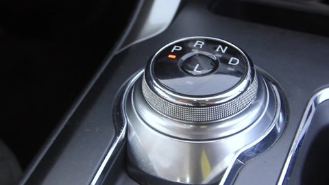 hand switches the automatic transmission in a circle
