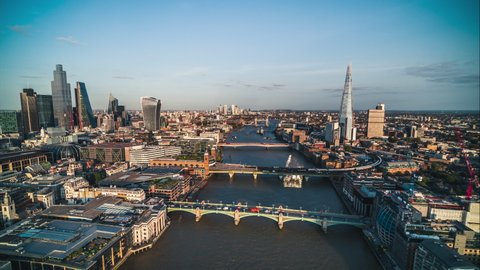 Establishing Aerial View Shot of London UK, London Skyline, City of London & Riverside, Southwark Bridge, London Bridge & Tower Bridge, United Kingdom, sunny day (part2)