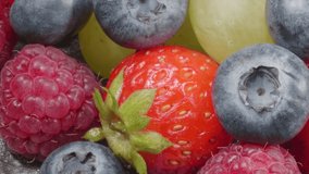 Ripe organic berries. Assorted fruits. Macro video.