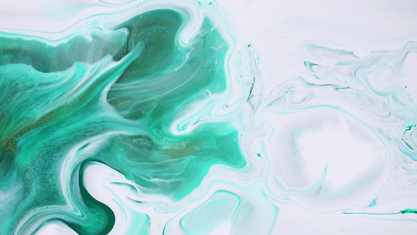 Fluid art painting video, abstract acryl texture with colorful waves. Liquid paint mixing backdrop with splash and swirl. Detailed background motion with green, white and emerald overflowing colors. | Shutterstock HD Video #1060448914