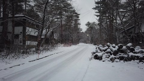 Hakuba, Japan - December 31,2019 : Rural street covered with snow in Hakuba, Japan on December 31,2019.