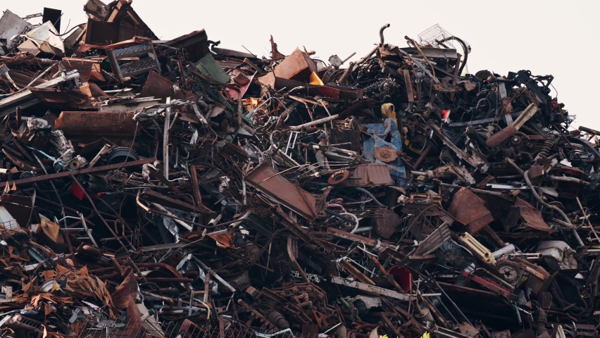Close-up Industrial and household scrap metal in a warehouse. Scrap metal at the recycling site Royalty-Free Stock Footage #1060458223