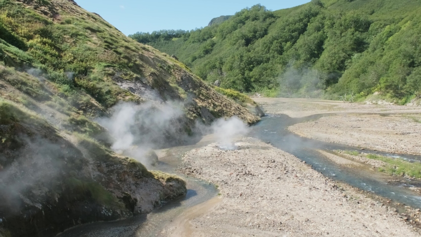 Hot springs and fumaroles in famous Valley of Geysers, Kamchatka peninsula, Russia, 4k