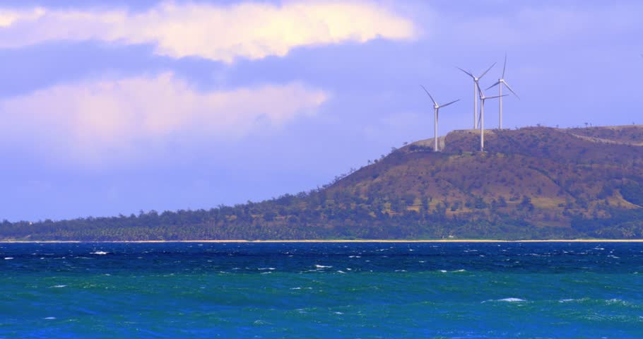 Wind mill turbines on ocean coast in Philippines
