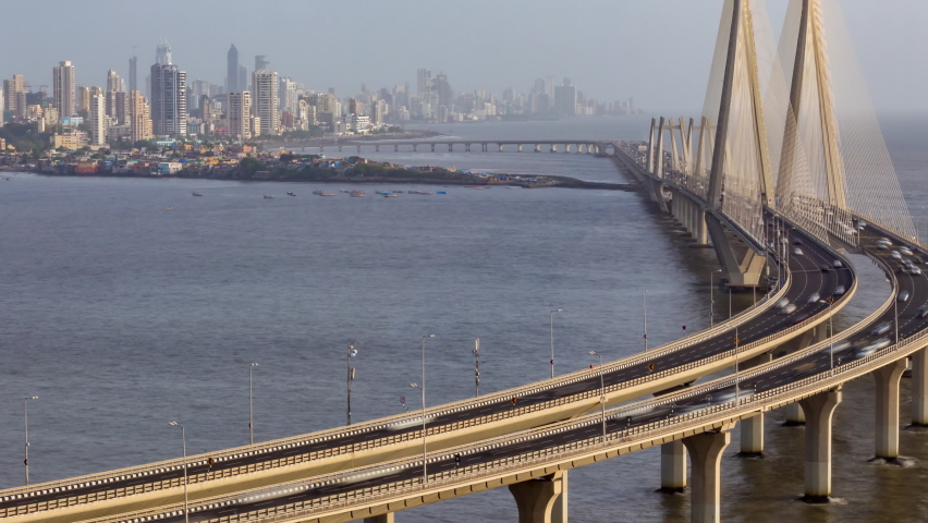 Aerial Time Lapse of Traffic passing over Bandra Worli Sea Link in Mumbai Downtown, Skyline, Cityscape View in Background, India Royalty-Free Stock Footage #1060470940