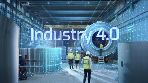 Futuristic Technology Concept: Team of Engineers and Professionals Workers in Heavy Industry Manufacturing Factory Digitalized with Graphics with Words Industry 4.0 Appearing. High-Tech Infrastructure